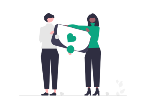 Two women holding a heart showing support