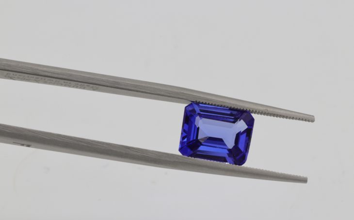 tweezers holding a gemstone